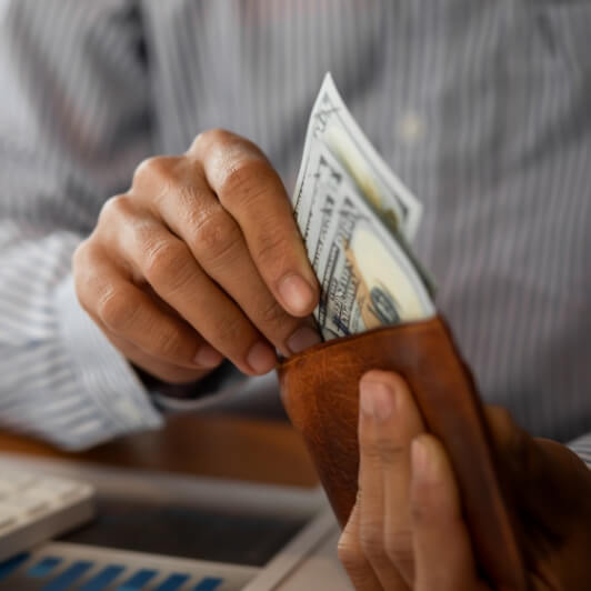 pulling cash from wallet